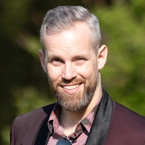 Joakim Bergman, smiling, outdoors